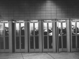 Busy Telephone Booths During an Airline Strike Premium Photographic Print by Robert W. Kelley