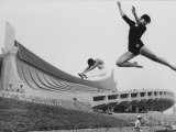 Gymnasts Outside the New Olympic Building in Japan Premium Photographic Print by Larry Burrows