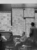 Large Board Containing Small Hand Written Pieces of Paper Announcing Various Jobs and the Salaries Photographic Print by Al Fenn