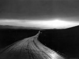 Ribbon of Road Leading Toward the Sunset Photographic Print by Peter Stackpole
