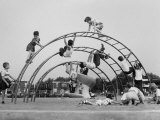 Children Playing on a Playground Premium Photographic Print by Werner Wolff