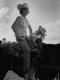 Jean Anne Evans, 14 Month Old Texas Girl, Falling Asleep on Horse with Her Mother Photographic Print by Allan Grant