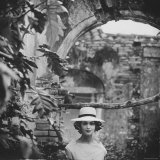 Dress and Hat with Multi Colored Rosettes Made of Ribbon on Each Side, by Cuban Designer Adolfo Photographie par Gordon Parks
