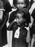 Very Young Jamaican Girl Scout with Surprised Look as She Watches the Arrival of Queen Elizabeth II Lámina fotográfica por Cornell Capa