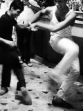 Two Young Italian Men Dancing to Music from a Jukebox in a Bar Reproduction photographique sur papier de qualité par Paul Schutzer