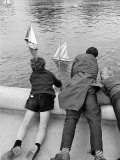 Trio of French Boys Sailing Boats in a Manmade Pond Premium Photographic Print by Alfred Eisenstaedt