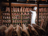 Meat Industry in the USA, Rib Roasts on Shelves and Butcher Making a Selection or Choice Photographic Print by Ralph Crane