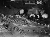 Two Men Lying on the Floor, Constructing a Railroad, at Toy Train Society Photographic Print by Alfred Eisenstaedt