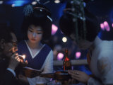 Patron of Nightclub Uruwashi Having His Cigarette Lit by Geisha Photographic Print by Eliot Elisofon