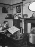 Robert Neve Reading Newspaper at Home Premium-Fotodruck von Hans Wild
