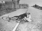 View of a Couple Lying on a Brick Road Premium-Fotodruck von Hans Wild