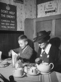 Mrs. Robert Neve and Son Peter Eating Supper in Restaurant Premium-Fotodruck von Hans Wild