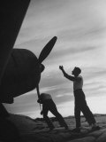 US Marines Pushing Through the Props of Bomber at US Naval Base on Midway Island Photographic Print by Frank Scherschel