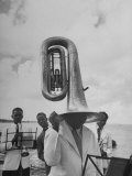 Tuba Player Keeping His Head Dry in a Rainstorm During Visit to St. Croix by Pres. Harry S. Truman Photographic Print by Thomas D. Mcavoy