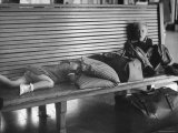 Two Children, One Sleeping, Waiting in the Depot For the Train to Arrive Photographic Print by Sam Shere