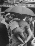 Woman Carrying Young Child on Her Back Through Marketplace on Queen's Road Premium Photographic Print by John Florea