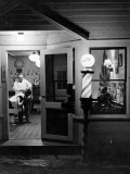 Small Town Barber Grover Cleveland Kohl Working in His Shop at Night Photographie par Alfred Eisenstaedt