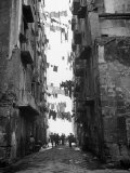 Slum Street with Laundry Hanging Between Buildings Photographic Print by Alfred Eisenstaedt