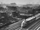 Train Moving Past Trackside Tenement Slums of Chicago Photographic Print by Gordon Coster