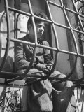 Resident of Italian Boystown Sitting in Barred Windowsill as Punishment For Wasting Bread Photographic Print by Hans Wild
