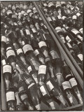 Prop Champagne Bottles in the Prop Department of Warner Bros. Studio Lámina fotográfica por Margaret Bourke-White