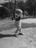 Two Year Old Golfer Bobby Mallick Taking a Swing Photographic Print by Al Fenn