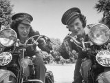 Woman and Her Daughter Sharing Interest in Motorcycle Racing Photographic Print by Sam Shere