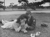 US Soldier and Japanese Girl Sharing Cigarettes, Which Soldiers Are Forbidden to Give Away Photographie par John Florea
