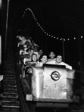 Teenagers in Rollercoaster at Night Premium Photographic Print by Gordon Parks