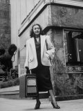 Woman Carrying Portable Television Set Which Operates Indoors or Outdoors Premium Photographic Print by George Skadding