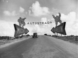 Michelin Man on Billboards at Entrance to the Turin Milan Autostrada Photographie par Alfred Eisenstaedt
