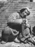 Typical Mongol Type Sitting by Street Photographie par George Lacks