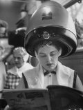 Woman Sitting under Hair Dryer Reading a Magazine Photographie par Gordon Parks