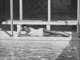 Model Posing Near a Pool Premium Photographic Print by Allan Grant