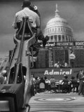 TV Camera Unit Operating Above Busy Election Eve Newsroom Premium Photographic Print by Al Fenn