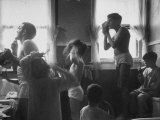 Professional Couple's Big Family, Sharing the Only Bathroom, Early in the Morning Photographie par Gordon Parks