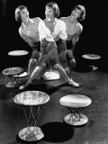 Multiple Exposure Showing Woman Oscillating on a Teeter Seat Designed by Isamu Noguchi Reproduction photographique sur papier de qualité par Eliot Elisofon