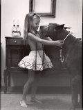 Model Posed Putting Costume Jewelry on Great Dane, Children's Fall Fashion Photographie par Nina Leen