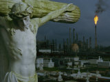 A Crucifixion Statue in Holy Rosary Cemetery Overlooks Petrochemical Plants Photographic Print by Joel Sartore