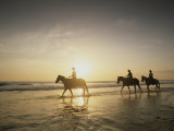 Horseback Riders Silhouetted on a Beach at Twilight, Costa Rica Photographic Print by Michael Melford