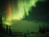 The Aurora Borealis Shimmers in the Night Sky Fotoprint van Norbert Rosing