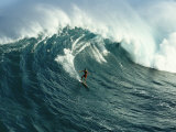 A Surfer Rides a Powerful Wave off the North Shore of Maui Island Photographic Print by Patrick McFeeley