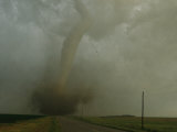 An F4 Category Tornado Barrels Down a Rural South Dakota Road Photographic Print by Peter Carsten