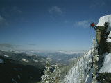 Rappeling with Snowboard, Red Mountain, British Columbia Photographic Print by Mark Cosslett