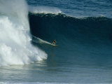 A Surfer Rides a Powerful Wave off the North Shore of Maui Island Photographic Print by Patrick McFeeley