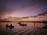 Silhouetted Fishermen on the Kissimmee River at Sunset Photographic Print by Medford Taylor
