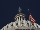 An American Flag and the Statue of Freedom Atop the Capitol Dome Photographic Print by Medford Taylor