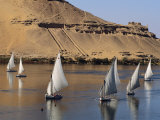 Feluccas on the Nile Sail Past the Tombs of Qubbat Al Hawa at Aswan Photographic Print by Kenneth Garrett