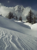 Mount Blanc Partially Obscured by Clouds in Snowy Landscape Photographic Print by Gordon Wiltsie