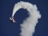 A Sharply Banking Bi-Plane at the Oshkosh Fly-In Air Show Photographic Print by Kenneth Garrett